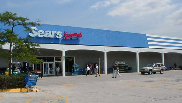 The Sears Essentials store front features blue and white.
